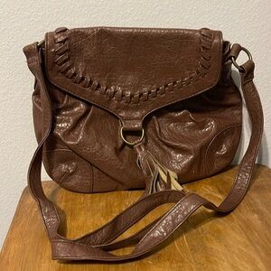 Stylish brown hobo bag with cute brown tassel. Unknown brand.